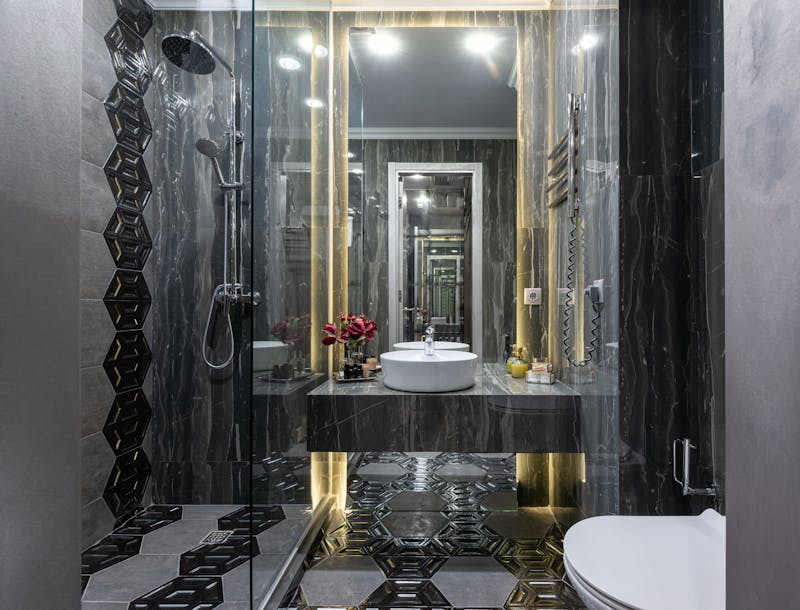 Contemporary black tile bathroom in Ontario