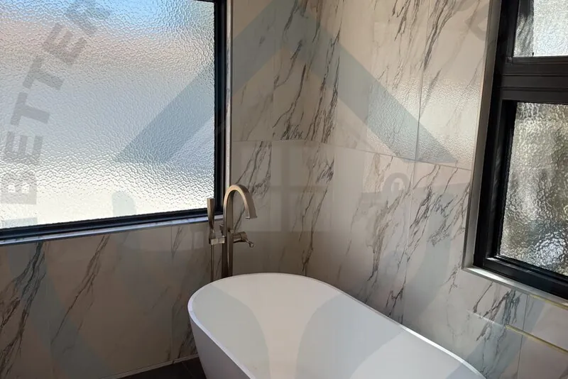 Contemporary black tile bathroom in Ontario