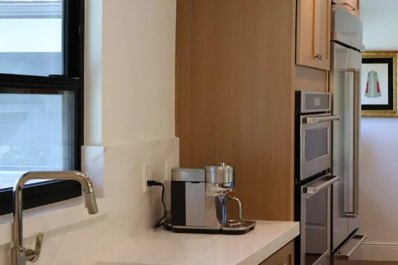 Kitchen island with pendant lighting in Riverside